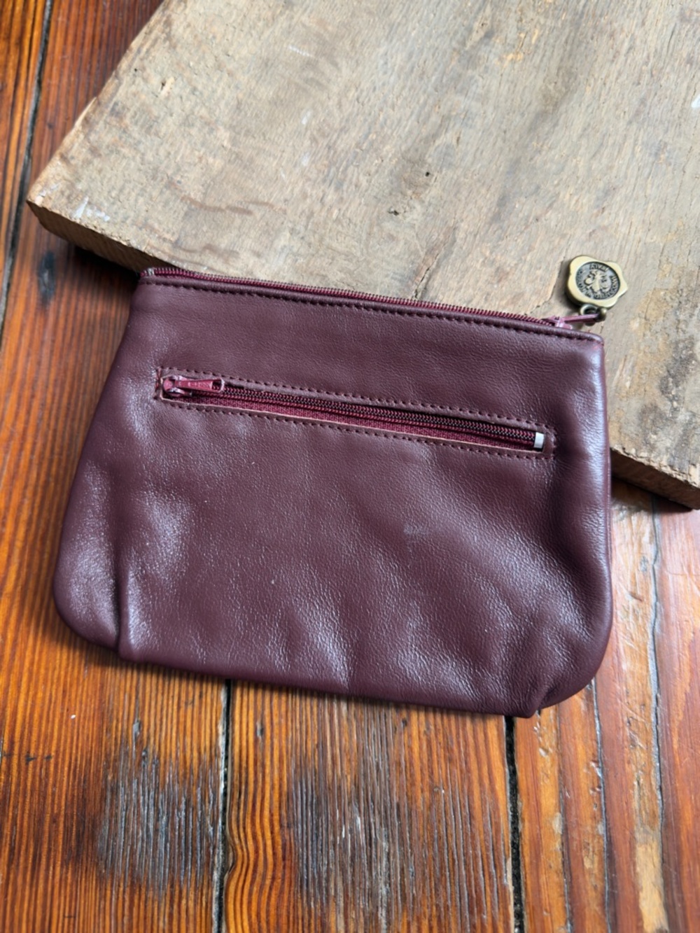 Vintage 70s/80s handmade leather clutch wallet w zipper pull medallion